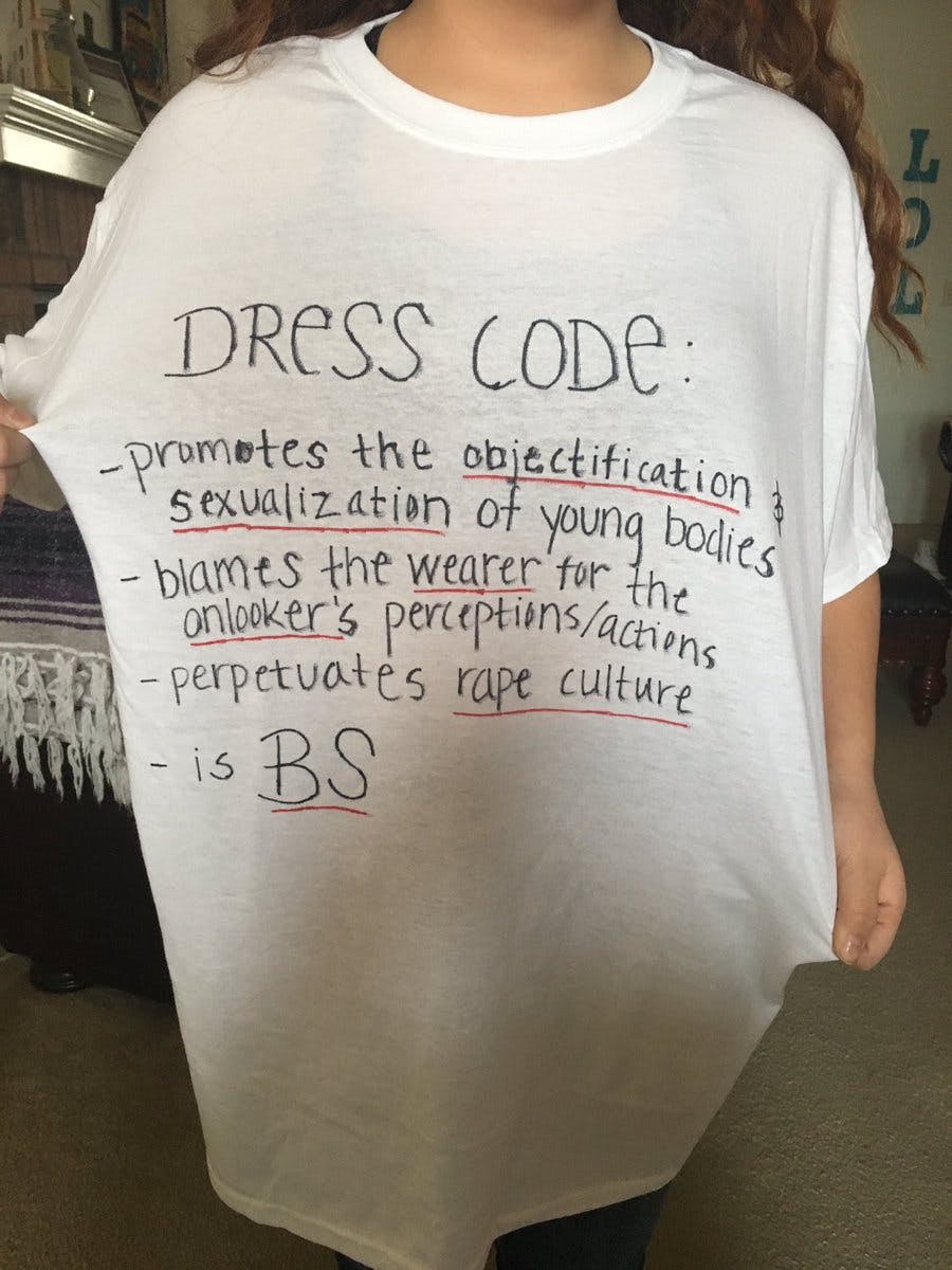 A shirt that 18-year-old Isabella Villegas made for her sister to wear the next time she feels the need to change her shirt for fear of getting written up for violating the dress code.