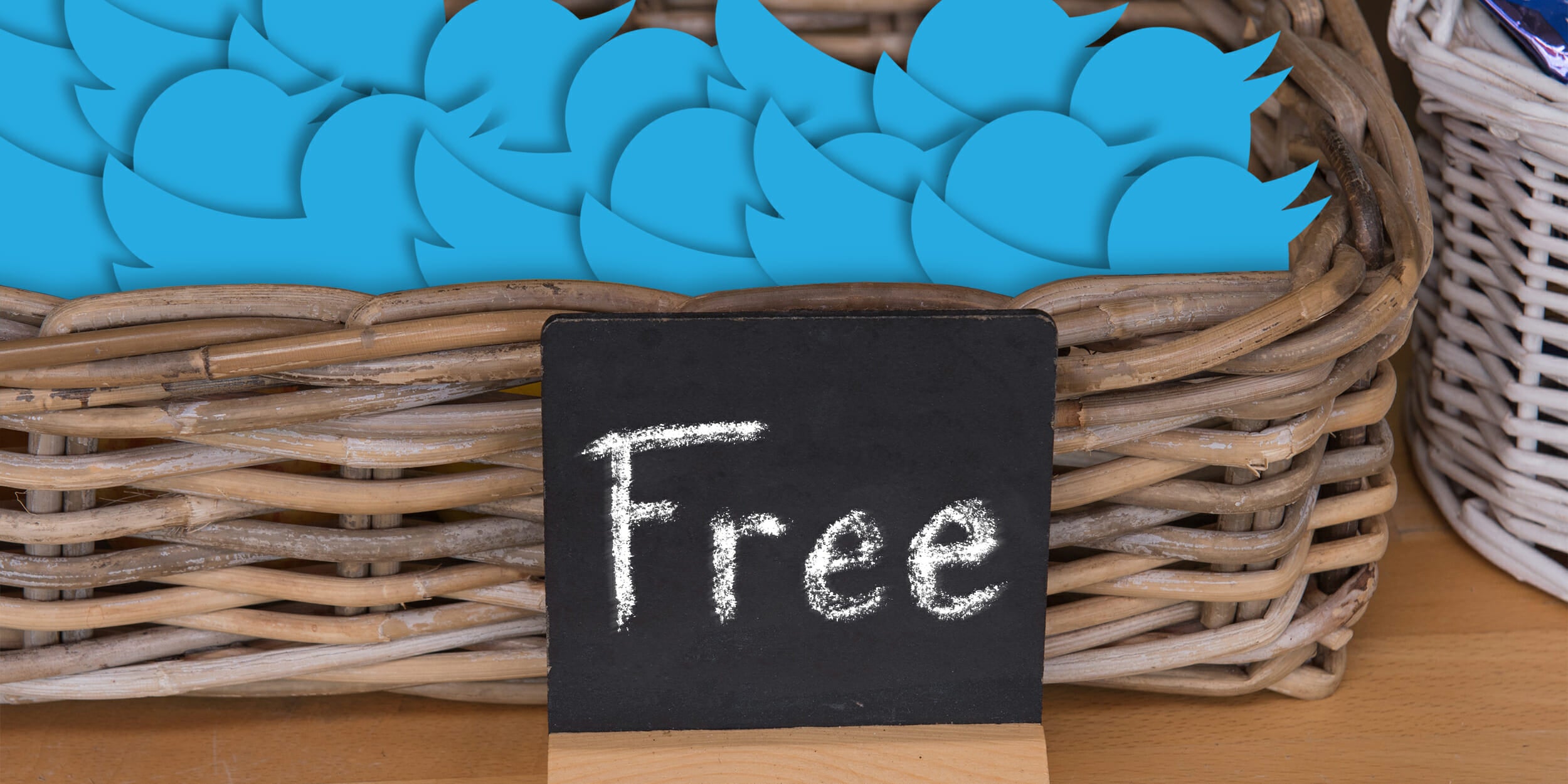 Twitter birds in basket with 'Free' sign written in chalk. This website is free Twitter.