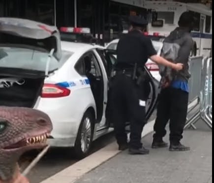 dude getting arrested while t-rex drums