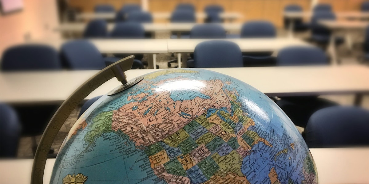Globe in empty classroom