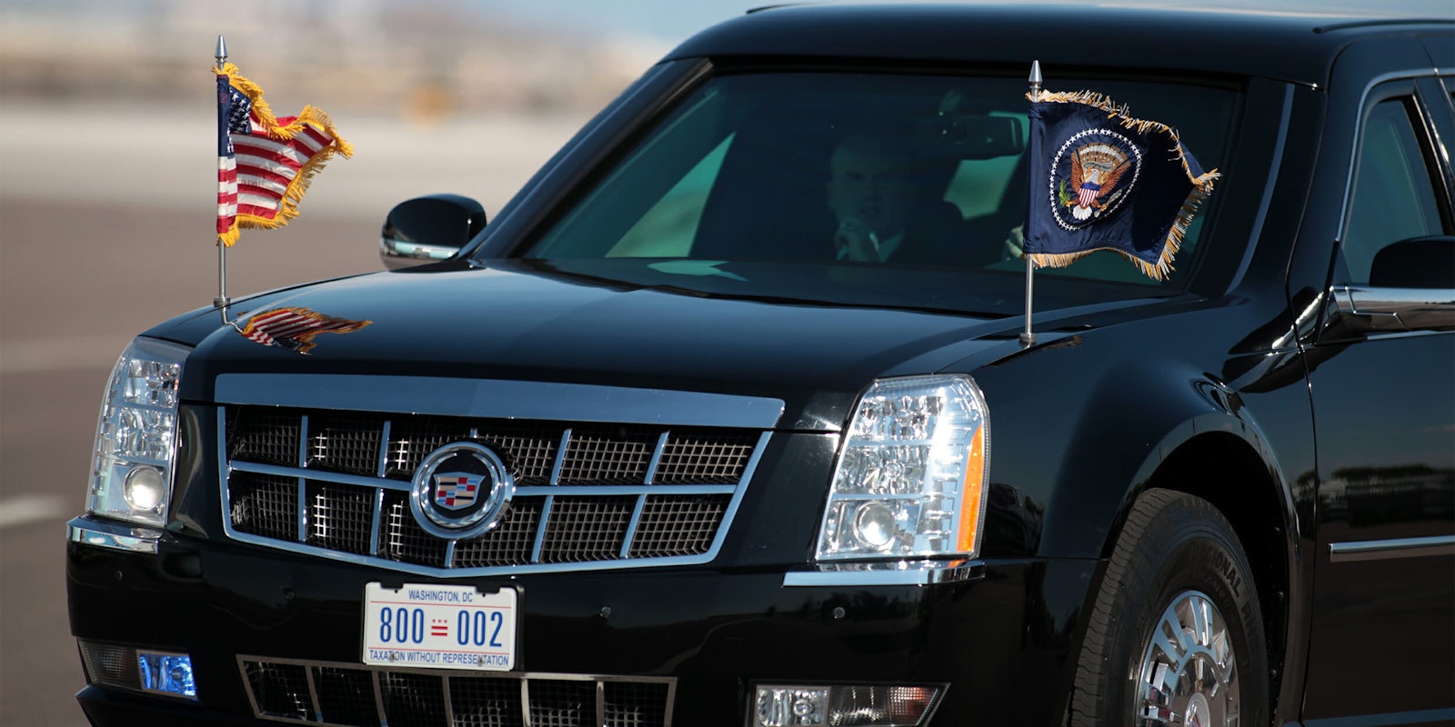 Flags waving on Presidential limousine