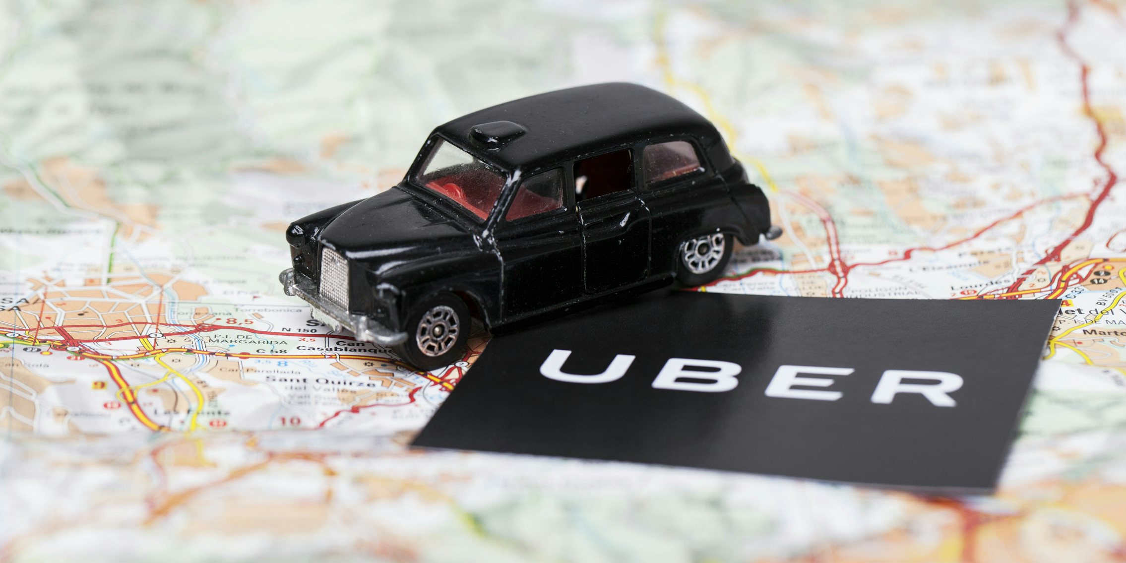uber logo on map with london black cab