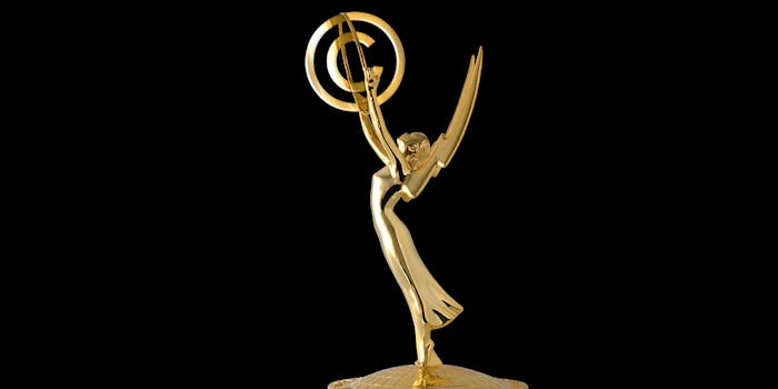 Emmy award statue holding copyright symbol