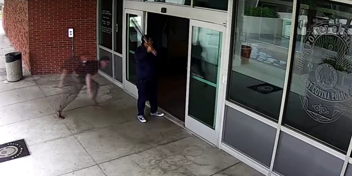 VIDEO: Man Tackled By Police After Swinging Baseball Bat At Window