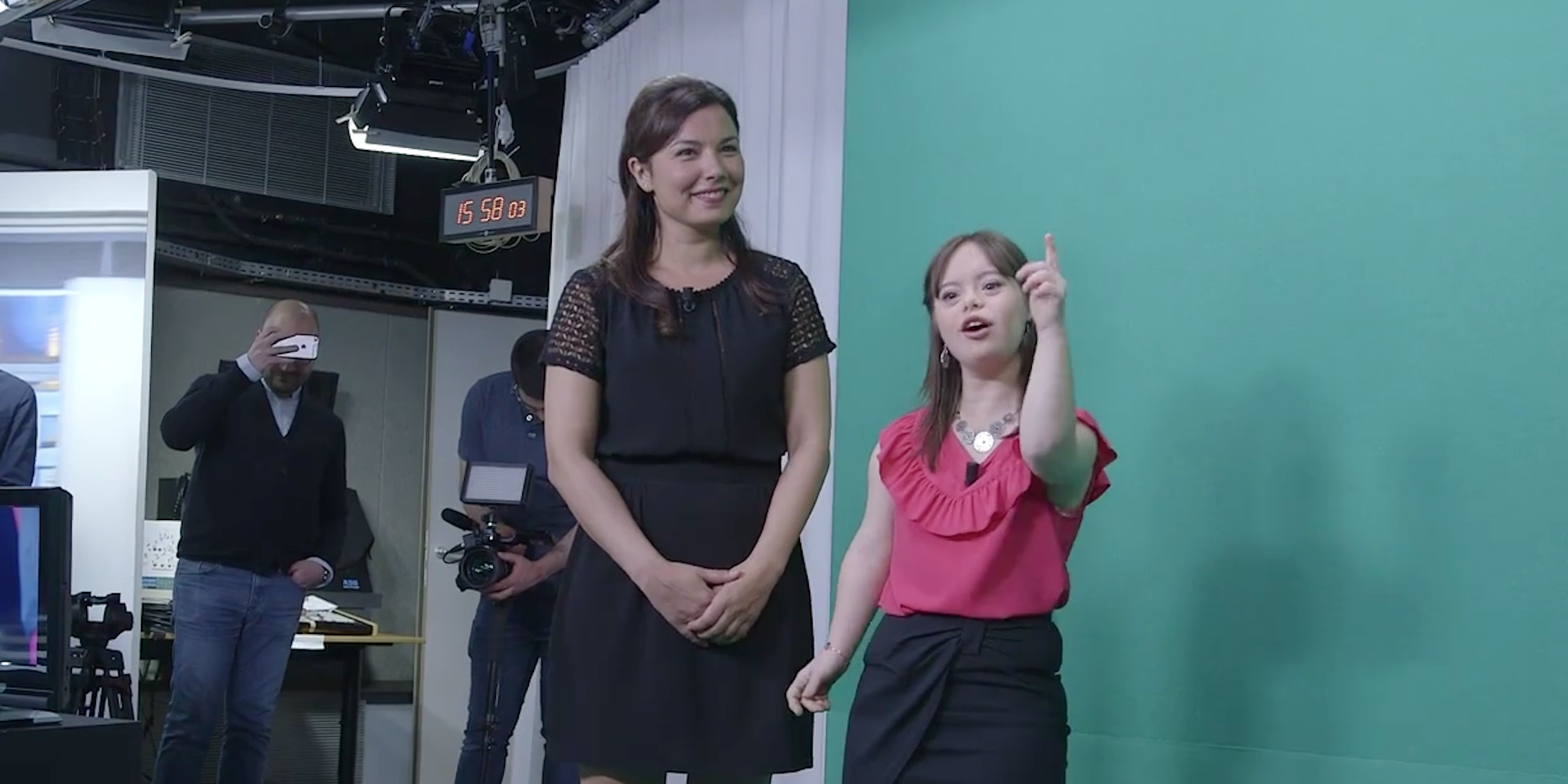21-year-old Melanie Segard stands next to a green screen as she fulfills her lifelong dream of presenting the weather on television.