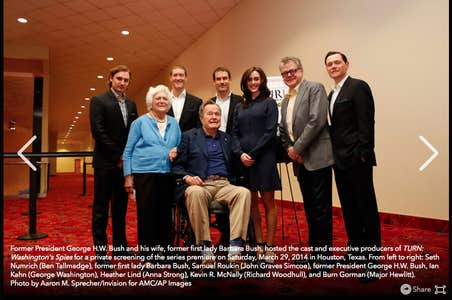 A photo of George HW Bush, Barbara Bush, and the cast and producers of Turn: Washington's Spies