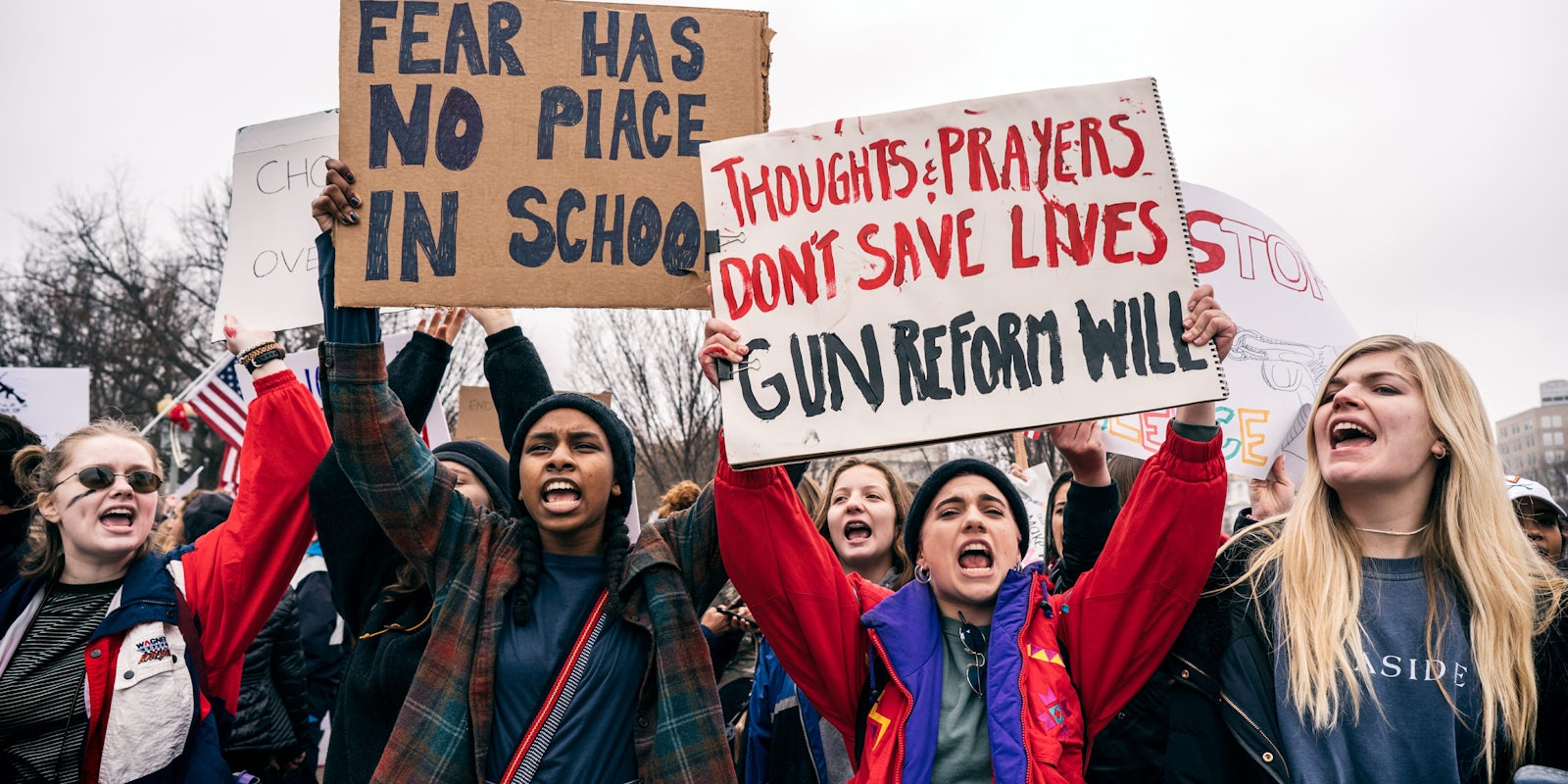 Teenage women protest for gun control reform in front of the White House.