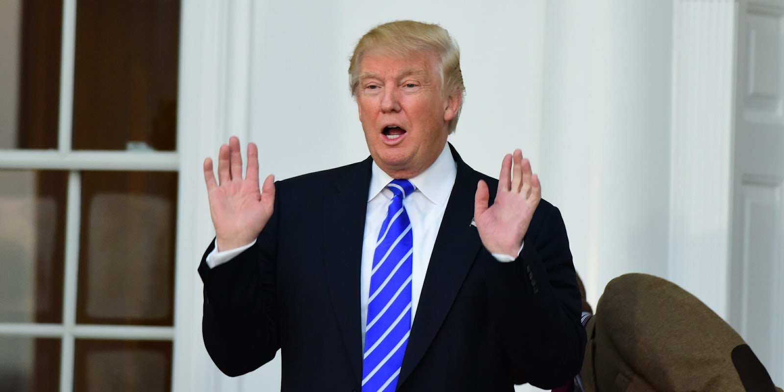Merriam-Webster : Donald Trump Holding His Hands in the Air