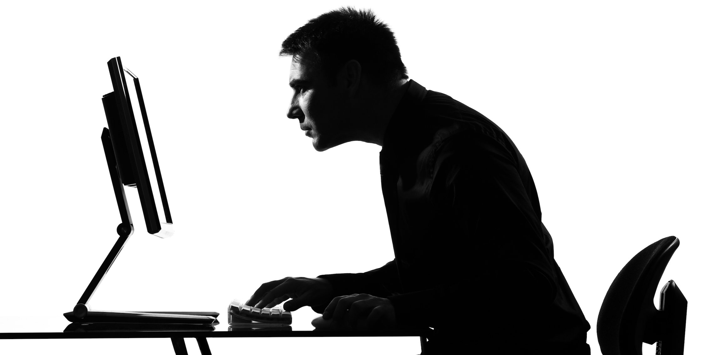 Silhouette of Man on Computer