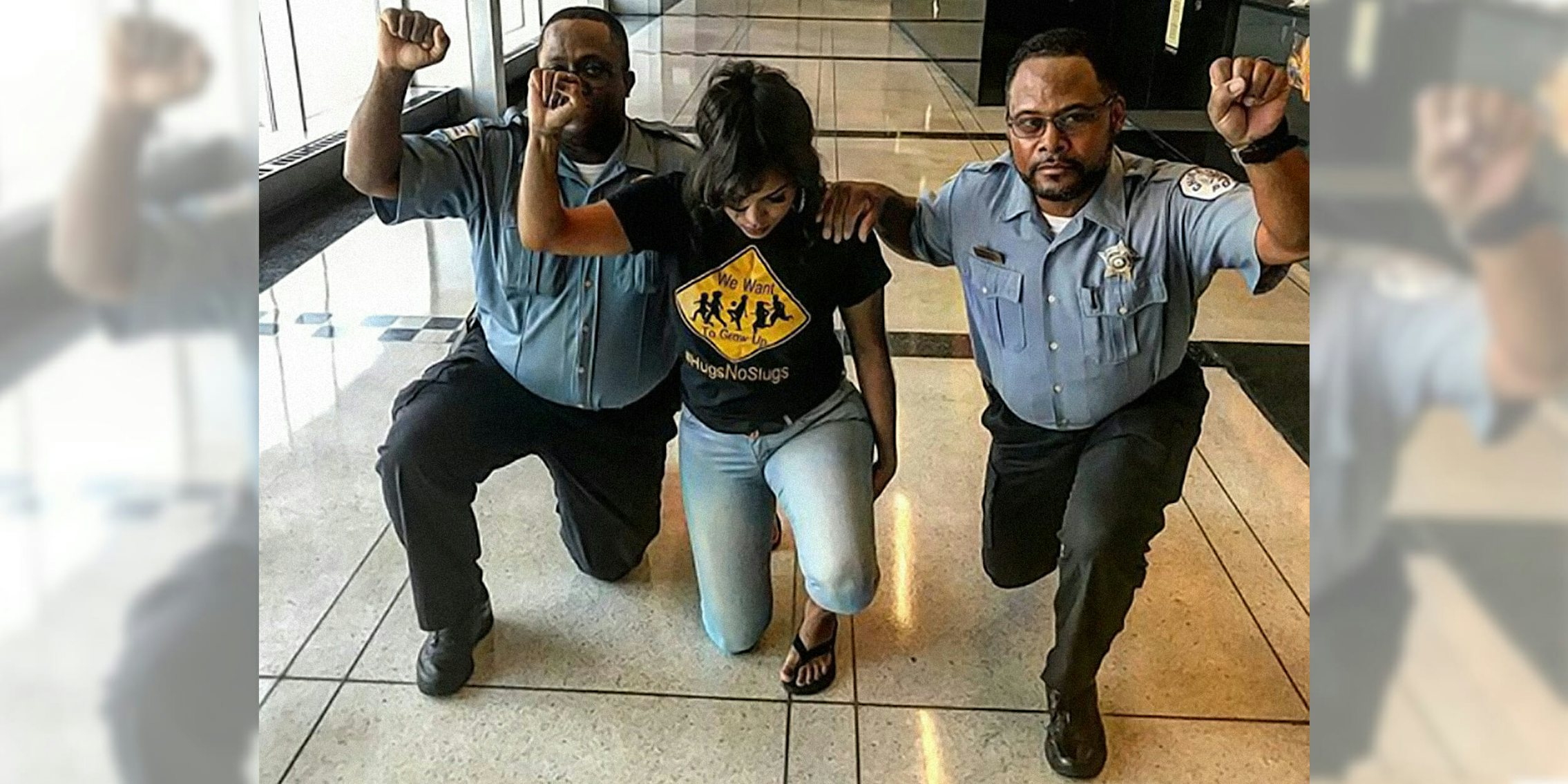 Chicago police kneel with activist Aleta Clark
