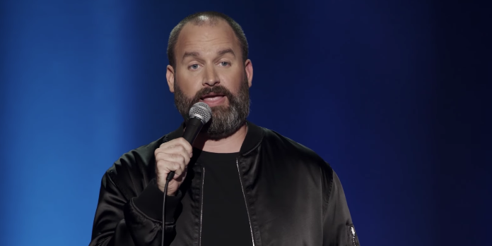 Tom Segura performing