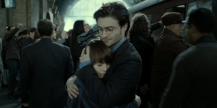 Harry Potter hugs Albus Severus Potter on his first day of Hogwarts