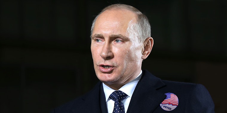 Vladimir Putin with 'I voted' American flag sticker