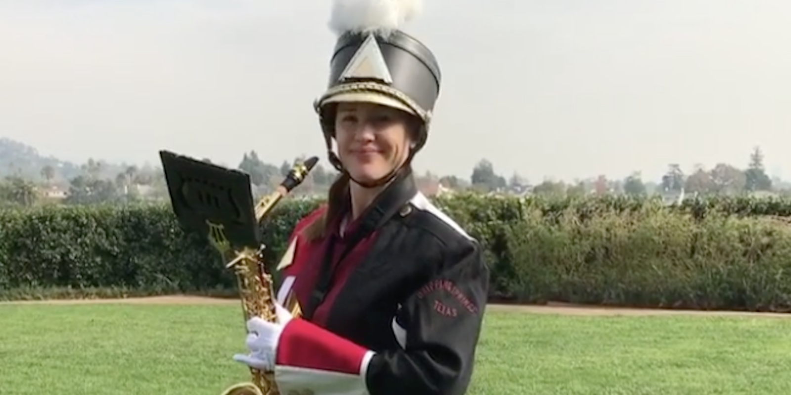Jennifer Garner smiles in a marching band uniform