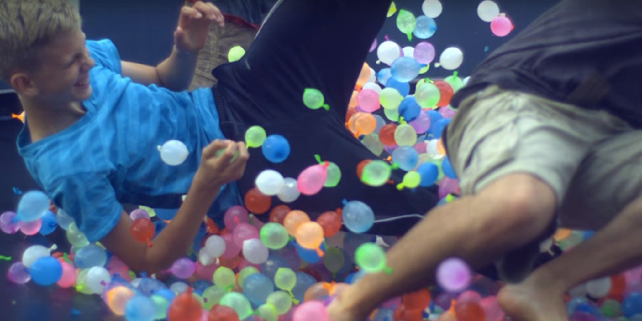 1,500 water balloons make bouncing around on a trampoline way more fun
