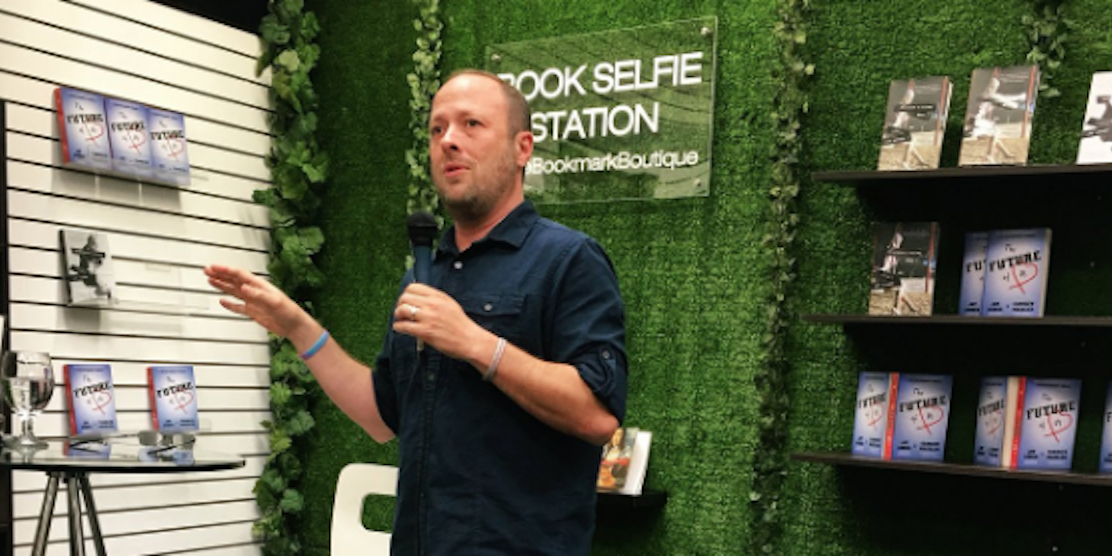 Jay Asher speaks into a microphone