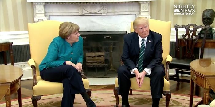 German Chancellor and U.S. President Donald Trump sit together for a photo op before their press conference, though Trump ignore's Merkel's question.
