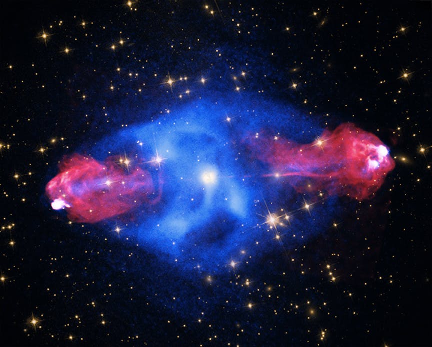 "Cygnus A: This galaxy, at a distance of some 700 million light years, contains a giant bubble filled with hot, X-ray emitting gas detected by Chandra (blue). Radio data from the NSF's Very Large Array (red) reveal "hot spots" about 300,000 light years out from the center of the galaxy where powerful jets emanating from the galaxy's supermassive black hole end. Visible light data (yellow) from both Hubble and the DSS complete this view."