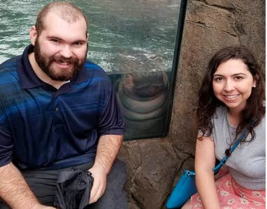 couple with baby hippo