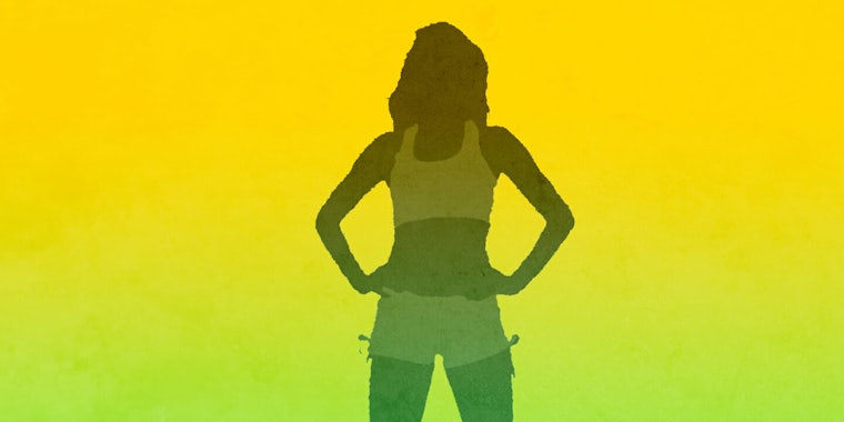A woman's silhouette standing in a power pose