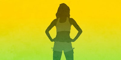 A woman's silhouette standing in a power pose