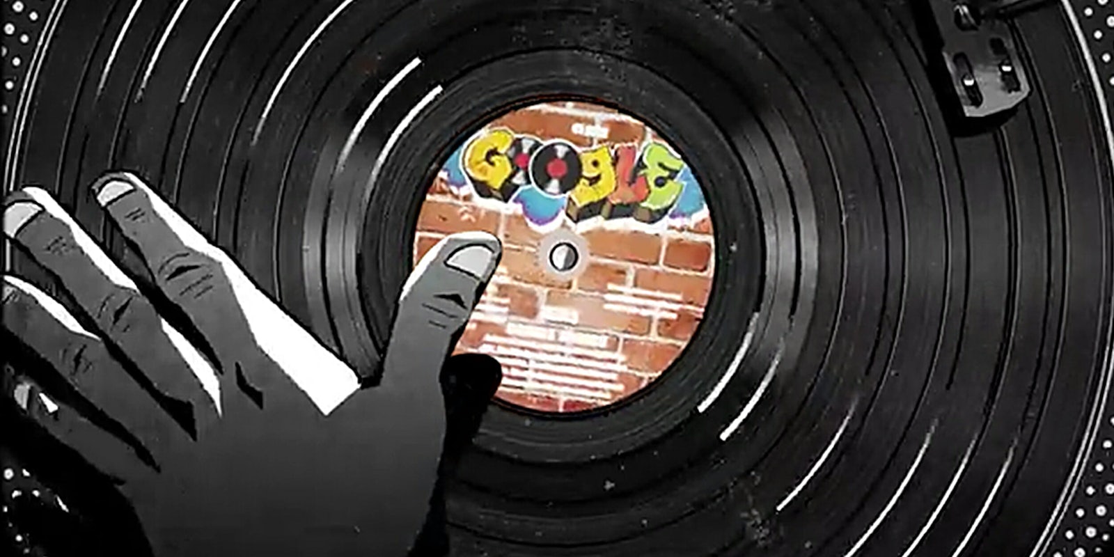 DJ hand scratching a Google album on a turntable