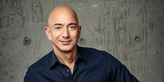 Jeff Bezos in navy shirt and blue jeans